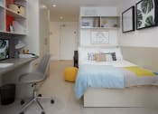 Thumbnail 21 of 49 - a bedroom with a bed and a desk