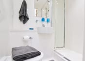 Thumbnail 24 of 49 - a bathroom with a toilet sink and shower