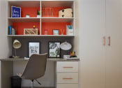 Thumbnail 25 of 49 - a desk with a chair and a lamp