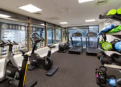 Thumbnail 7 of 49 - a room filled with lots of different types of exercise equipment