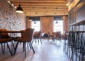 Thumbnail 16 of 49 - a restaurant with a brick wall and wood floors
