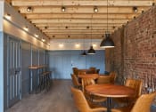 Thumbnail 17 of 49 - a room with wooden ceilings and brick walls