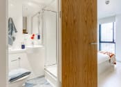 Thumbnail 31 of 49 - a ensuite bathroom with a toilet sink and shower