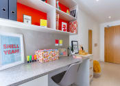 Thumbnail 33 of 49 - a home office with a desk and chair