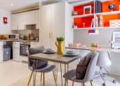 Thumbnail 41 of 49 - a kitchen and dining area in a 555 waverly unit