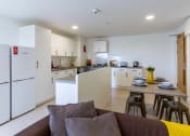 Thumbnail 20 of 49 - a view of the kitchen and dining area in a 555 waverly unit