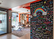 Thumbnail 15 of 51 - A chalkboard with various messages written on it.