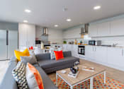 Thumbnail 17 of 51 - Shared flat kitchen, with cooking appliances and plenty of cupboard space, a large sofa and coffee table.