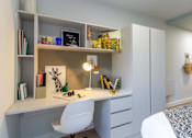 Thumbnail 24 of 51 - White desk in the bedroom, with plenty of shelving, drawers and a chair.