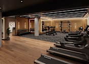 Thumbnail 2 of 21 - A gym with treadmills and other exercise equipment.