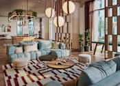 Thumbnail 1 of 21 - A modern living room with a large sectional sofa, a coffee table, and a rug.