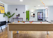 Thumbnail 10 of 35 - A pool table with balls set up in the middle of it.