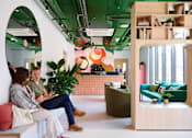Thumbnail 9 of 36 - Two people sitting on a bench in a room with a green ceiling.