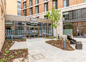 Thumbnail 1 of 56 - A building with a glass facade and a sign that says "VENTI HOUSE" is shown.