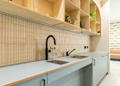 Thumbnail 52 of 56 - A kitchen with a sink and a counter.