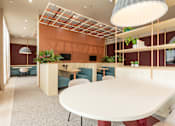 Thumbnail 31 of 56 - A modern dining area with a white table and blue chairs.