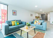 Thumbnail 17 of 56 - A living room with two couches and a coffee table.