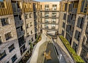 Thumbnail 5 of 23 - an aerial view of an apartment building with a walkway in the middle