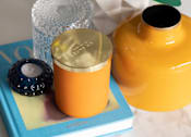 Thumbnail 9 of 10 - a table with a yellow vase and a book on it