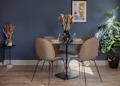 Thumbnail 4 of 23 - a dining room with a table and chairs and a blue wall