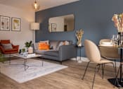 Thumbnail 22 of 23 - a living room and dining room with blue walls and a table and chairs