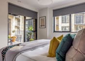 Thumbnail 21 of 23 - a bedroom with a large bed and a window