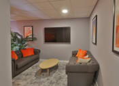 Thumbnail 4 of 8 - a living room with two couches and a television