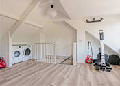 Thumbnail 6 of 7 - a white laundry room with a washing machine and a dryer