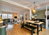 Thumbnail 5 of 7 - a living room with a dining room table and a kitchen