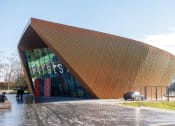 Thumbnail 12 of 12 - a building with a triangular roof