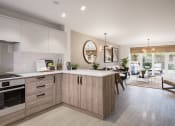 Thumbnail 2 of 12 - an open plan kitchen and dining area