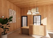 Thumbnail 4 of 23 - A wooden reception desk with a potted plant in front of it.