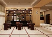 Thumbnail 10 of 37 - A well-lit, modern lounge area with a long sofa and a bar.