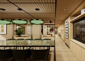 Thumbnail 4 of 37 - A restaurant with a long table and chairs under green lamps.