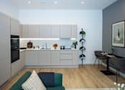 Thumbnail 21 of 37 - A modern kitchen with a dining table and chairs.