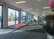 Thumbnail 31 of 32 - a gym with a yoga ball and exercise equipment in the lobby of a building at The Keel Apartments, Liverpool, L3 4GE