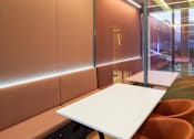 Thumbnail 9 of 32 - a table in a meeting room with orange chairs at The Keel Apartments, Liverpool, L3 4GE