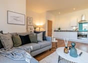 Thumbnail 11 of 32 - a living room with a couch and a coffee table at The Keel Apartments, Liverpool