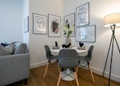 Thumbnail 15 of 32 - a dining room with a table and chairs and a lamp at The Keel Apartments, Liverpool, L3 4GE
