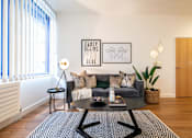 Thumbnail 16 of 32 - a living room with a couch and a coffee table at The Keel Apartments, Liverpool, L3 4GE