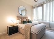 Thumbnail 21 of 32 - a white bedroom with a bed and a mirror at The Keel Apartments, Liverpool