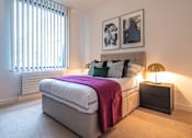 Thumbnail 24 of 32 - a bedroom with a bed and a window at The Keel Apartments, Liverpool