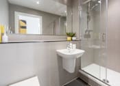 Thumbnail 26 of 30 - a bathroom with a sink and a shower at Vox Apartments, Manchester, M15 4YD