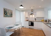 Thumbnail 9 of 10 - Kitchen and Dining Area
