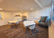 Thumbnail 2 of 11 - a room with a table and chairs and a window