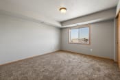 Thumbnail 101 of 126 - a bedroom with grey walls and carpet