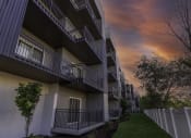 Thumbnail 24 of 25 - a row of apartments with balconies at sunset