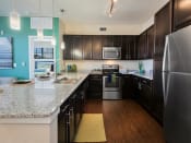 Thumbnail 3 of 11 - model kitchen stainless steel appliances with black cabinets