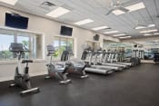 Thumbnail 10 of 34 - an image of a gym with treadmills and ellipticals