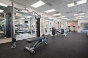 Thumbnail 11 of 34 - a photo of a gym with free weights and other exercise equipment